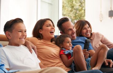 Hispanic family watching tv