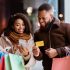 African American man and women shopping and using mobile