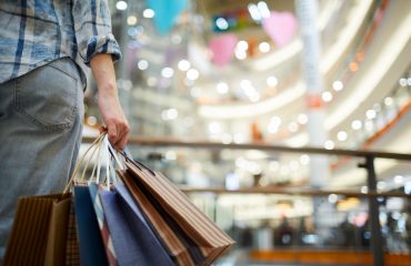 Woman holding shopping bags in the mall.