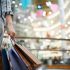 Woman holding shopping bags in the mall.