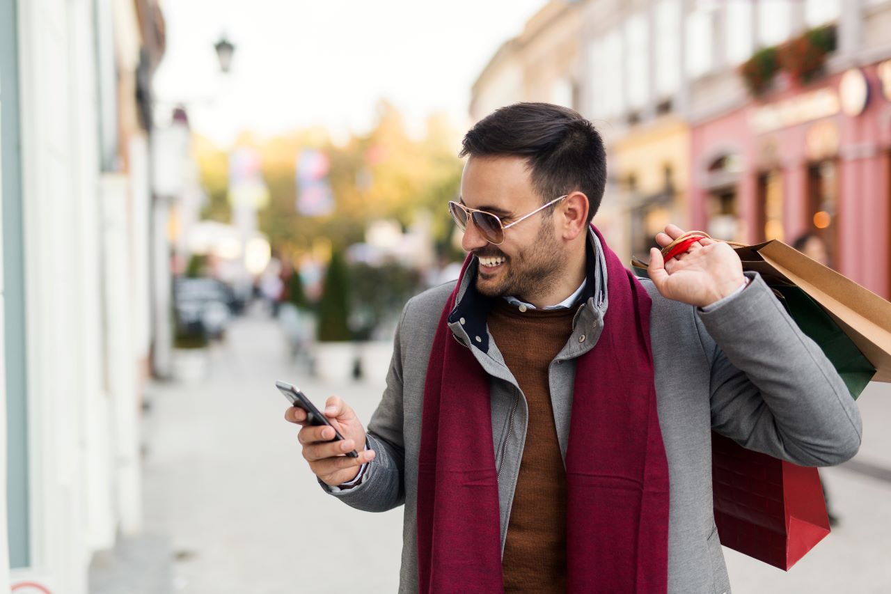 Man holiday shopping with bags