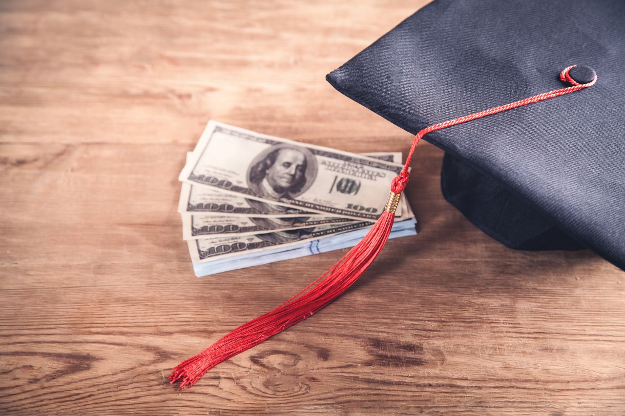 Graduation cap and dollars