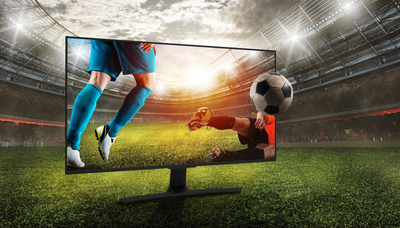 Soccer players on a tv in a soccer field