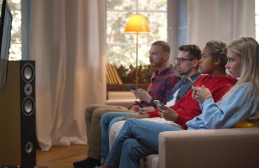Young viewers watching tv and on their phones